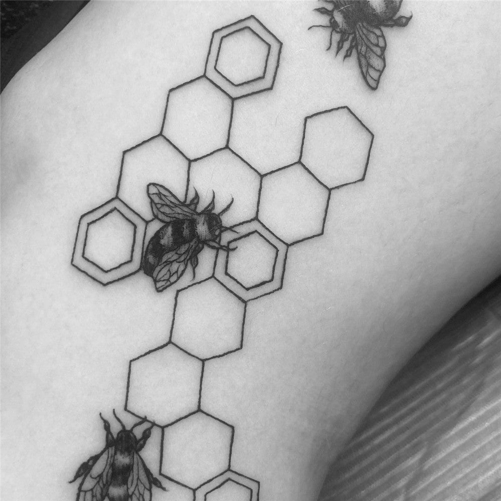 Floral bee and honeycomb tattoo by Larissa Long