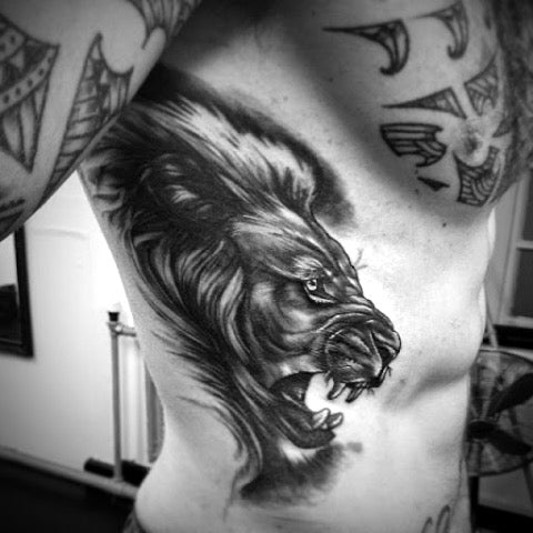 Lion Rib Tattoo