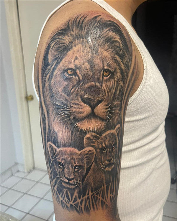 Microrealistic lion and lioness tattoo located on the