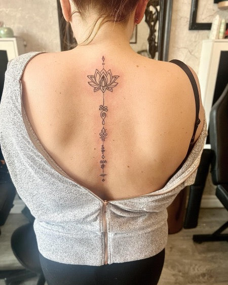 Delicate lotus spine tattoo  Spine tattoos for women Spine tattoos  Shoulder tattoo quotes
