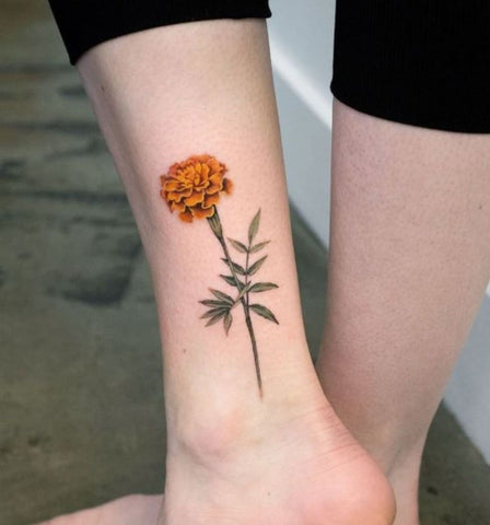 Marigold flower tattoo  Tattoos Flower tattoo Tattoos and piercings