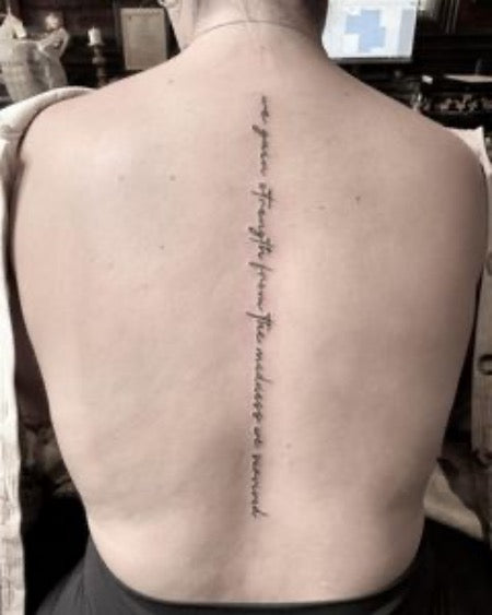 spine tattoo words