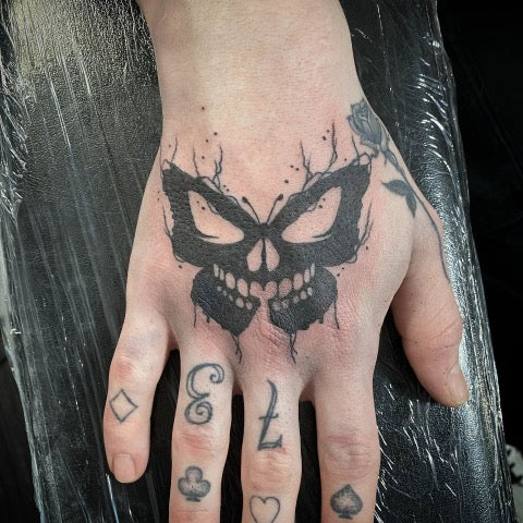 Attractive Butterfly skull hand tattoo