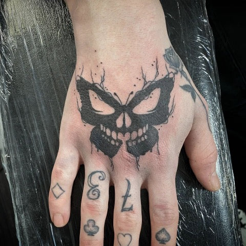 Evil Skull Hand Tattoo