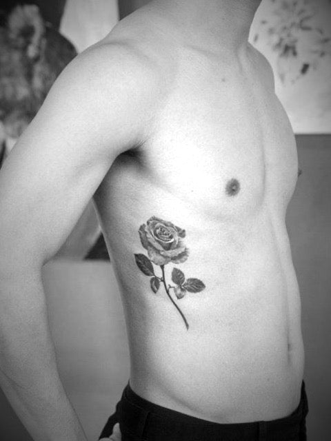 Small Flower Rib Tattoo