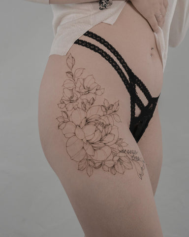 cherry blossom thigh tattoo