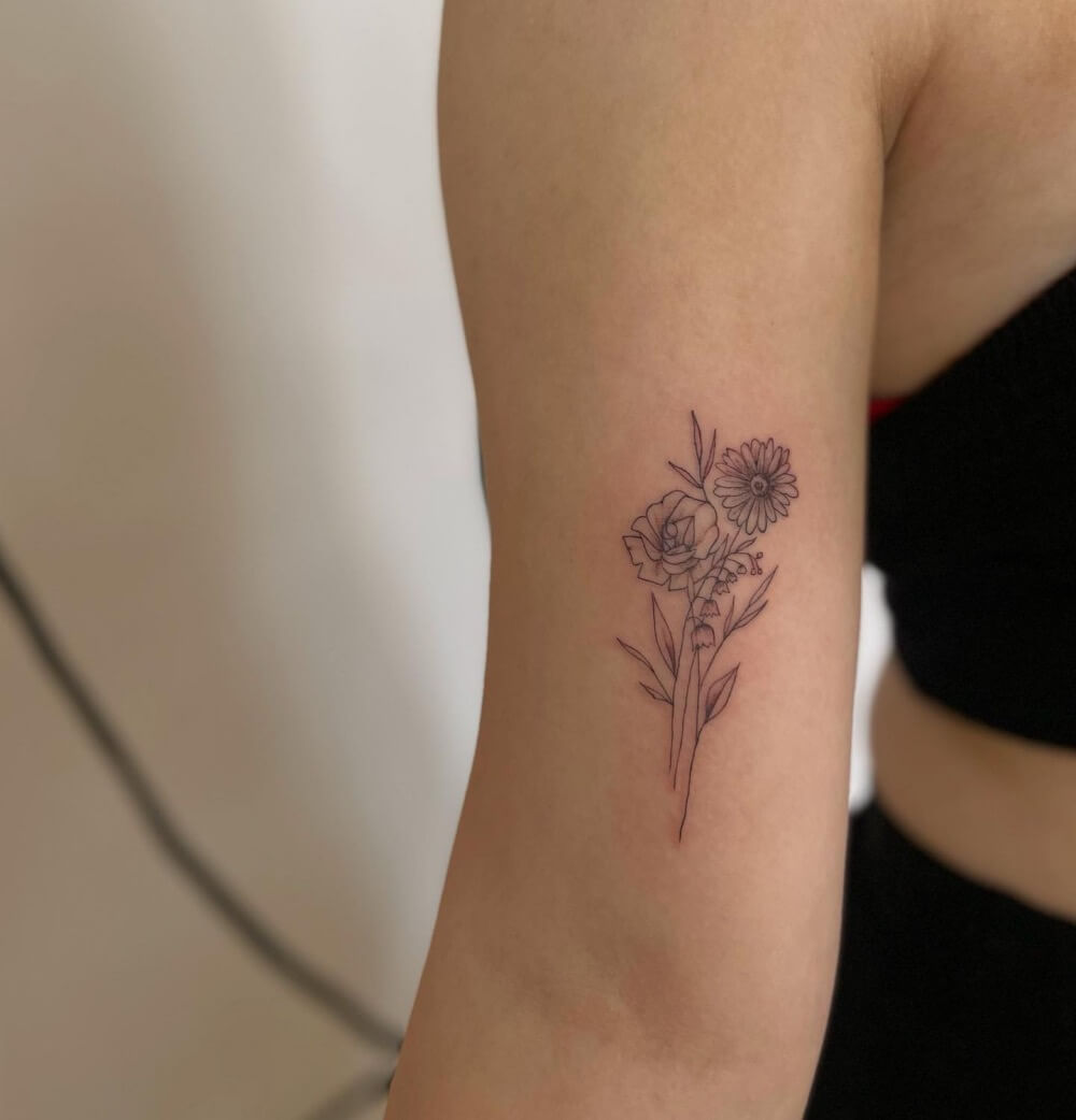 daisy and lily of the valley tattoo