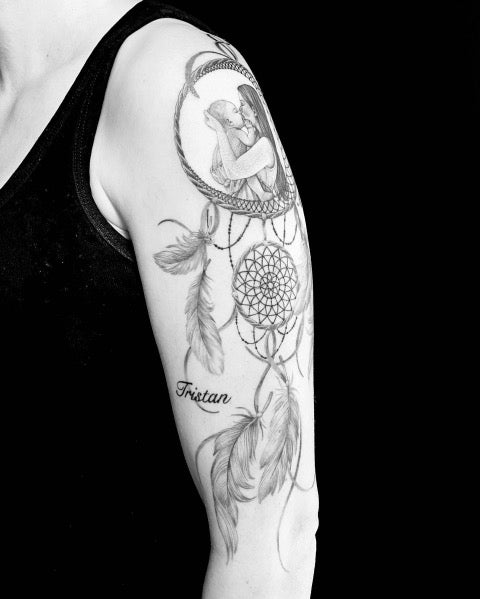 dream catcher tattoo on arm
