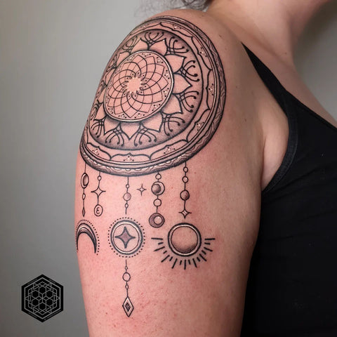 dream catcher tattoo on shoulder