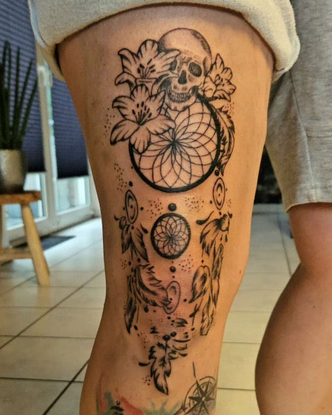 dream catcher tattoo on thigh