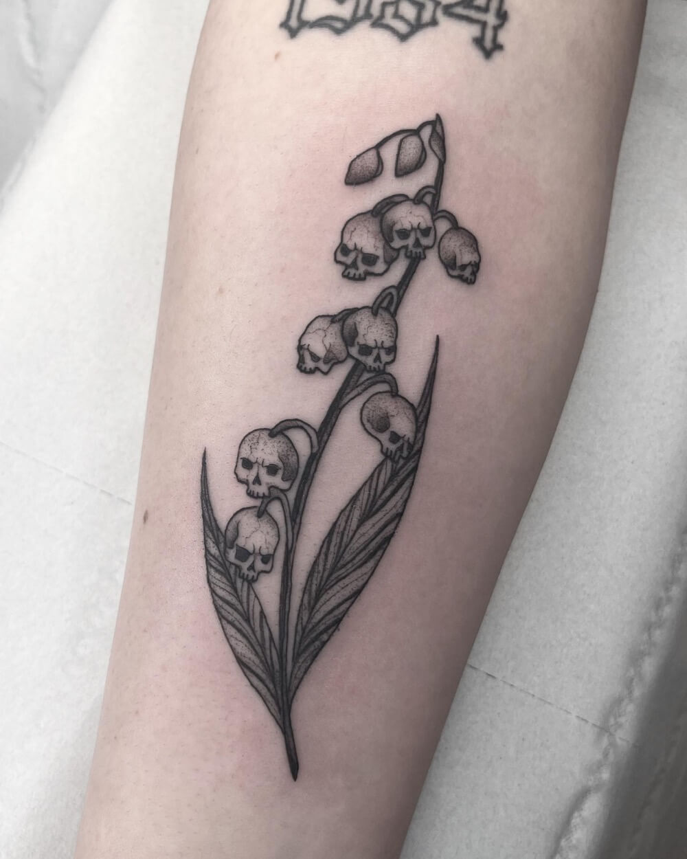 Lily of the Valley Skull Tattoo