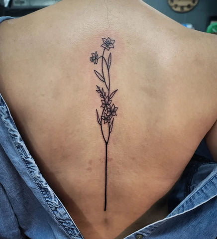 minimalist gladiolus tattoo