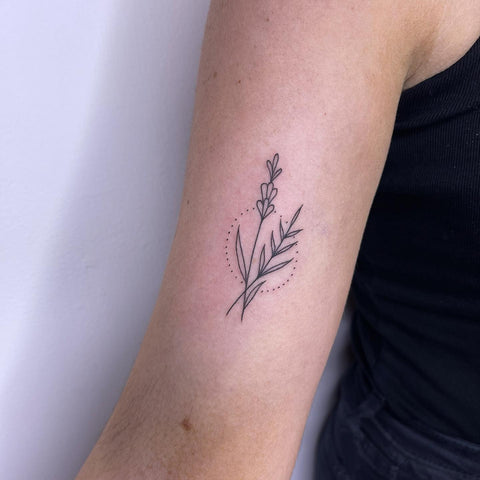 Small minimalist wildflower tattoo with fine black lines and detailing Flower  tattoo black tattoo fe  Wildflower tattoo Small flower tattoos  Feminine tattoos