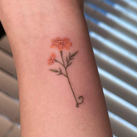 simple marigold tattoo