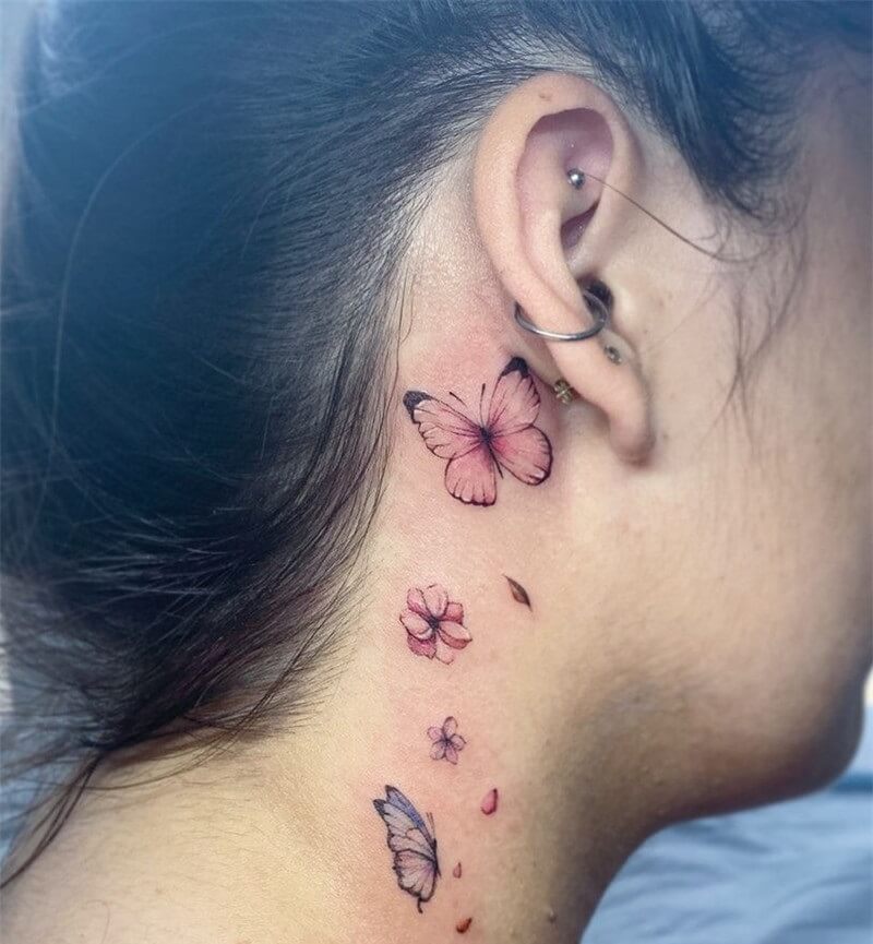 Behind the ear butterfly tattoo with flower