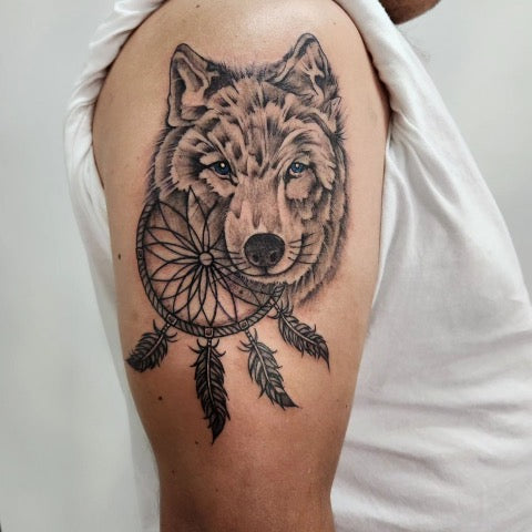 wolf with dream catcher tattoo