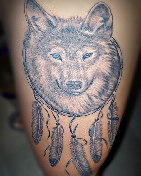 wolf with dream catcher tattoo