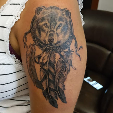 wolf with dream catcher tattoo