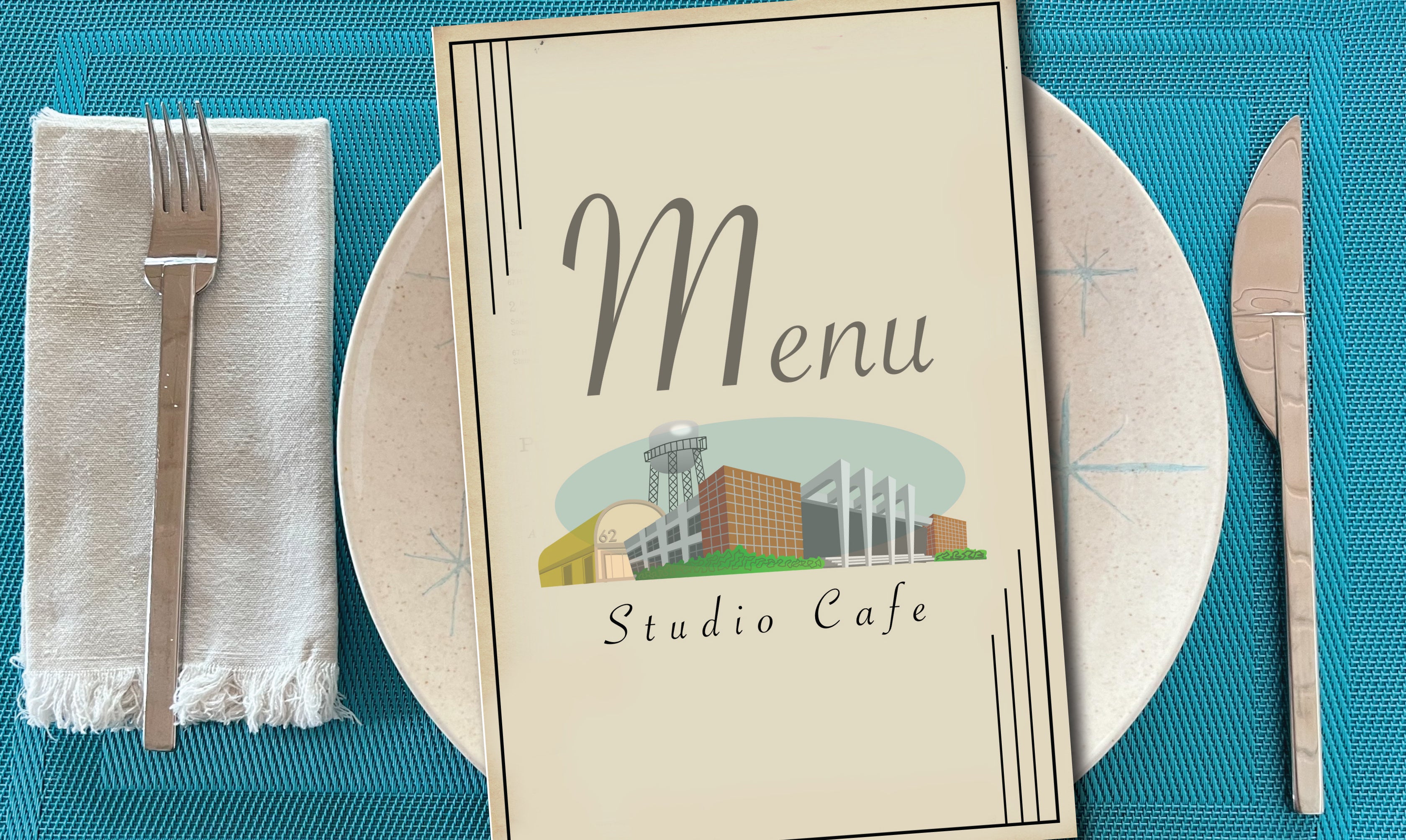 Image shows a place setting with a plate, napkin, knife and fork. On the plate is a menu, which shows an image of a studio, and "Studio Cafe" below.