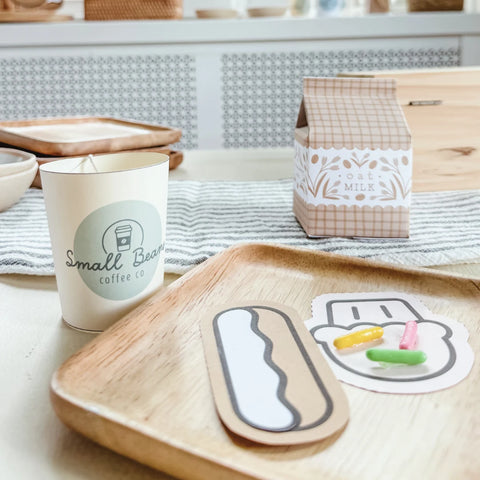coffee shop pretend play scene with paper coffee cup, paper milk carton and crafted paper snacks