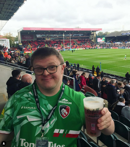 Ross From Stand Out Socks Holding A Beer At the Stadium of Leicester Tigers