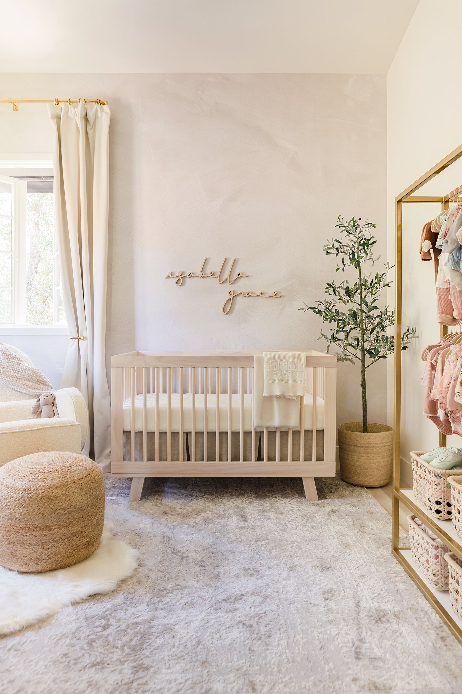 neutral nursery with a name sign