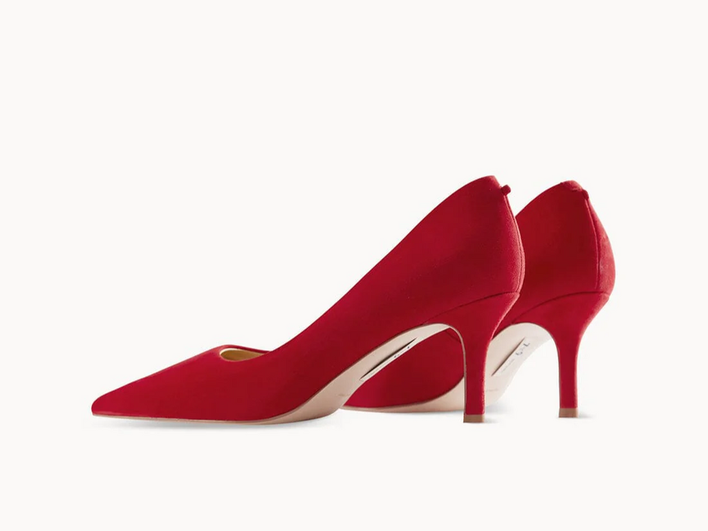 Red heels, in various shades, effortlessly add a cheerful and spicy pop to any outfit, perfect for both casual and special occasions.