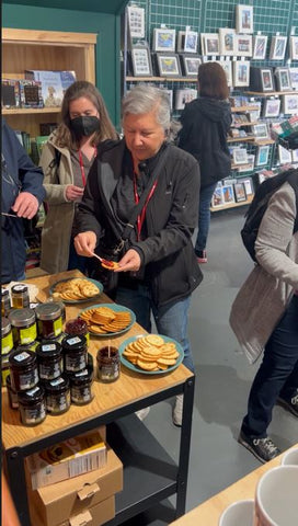 Tourists sampling local food products, 