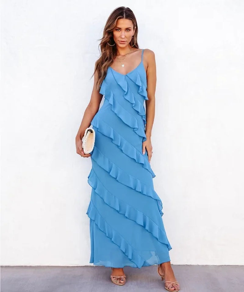 Blue halter dress with backless design and side slit details.