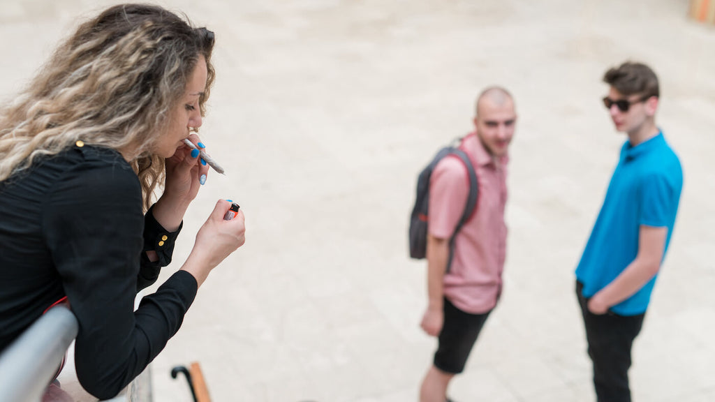 High-school Student Smoking Weed in Front of Her Friends Causing Second Hand Smoking