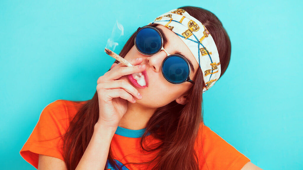 Hippy Girl Smoking Weed and Wearing Sunglasses on Light Blue Background