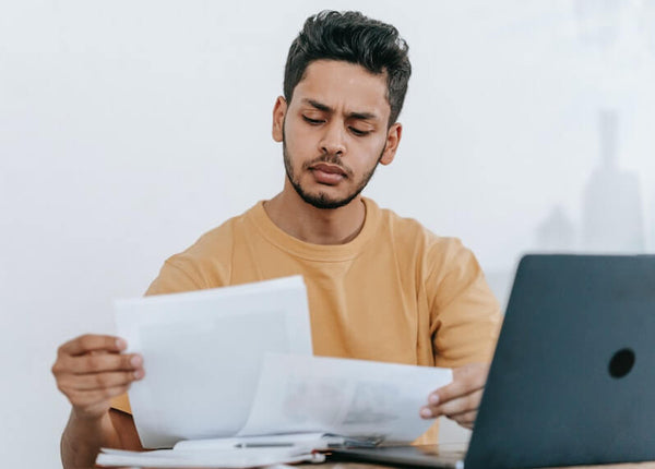 Man Reading About Why CLIA Waived Drug Tests Are Better