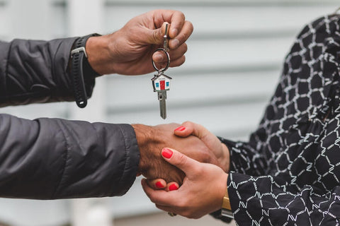 Real Estate Agent Giving a Person the Keys to a New Home