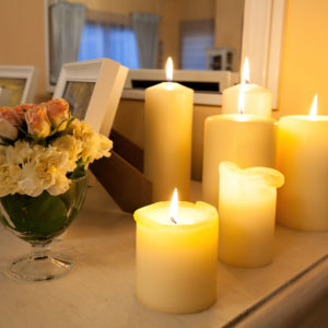 yellow pillar candles in different height