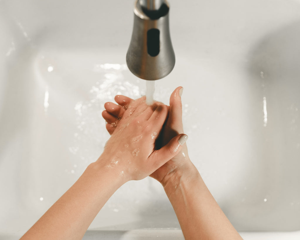 Person washing hands photo