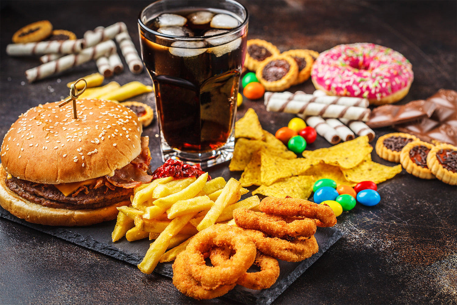 Junk food spread out on a photodrop background