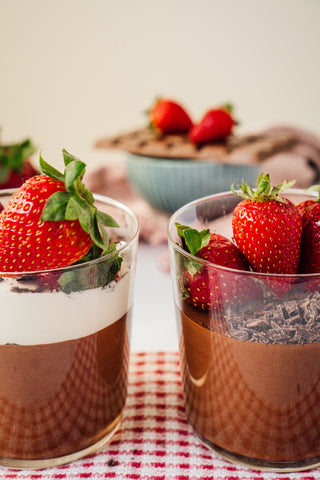 vegan avocado chocolate mousse with strawberry toppings