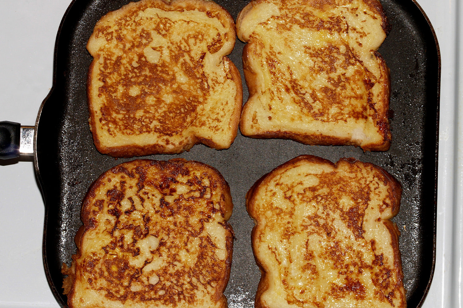 French toast cooking on a stovetop