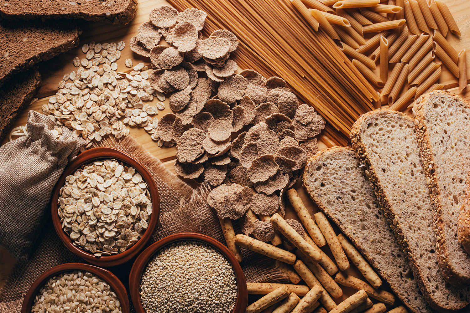 oats and other types of carbs layed out on a table