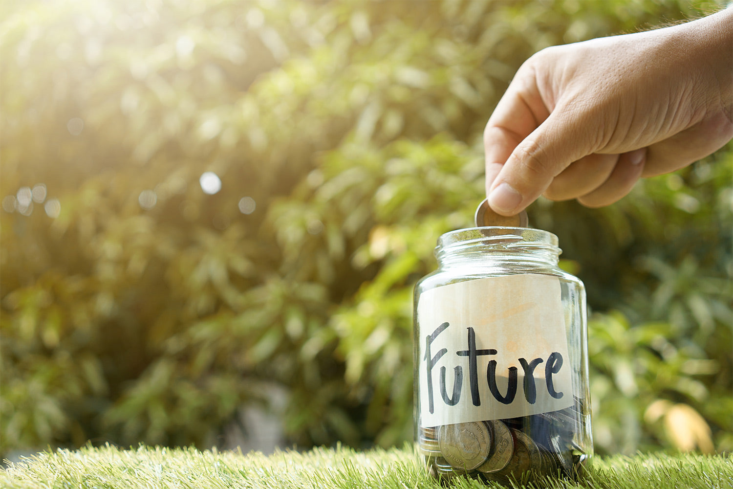 Man putting money into a jar labeled "Future"