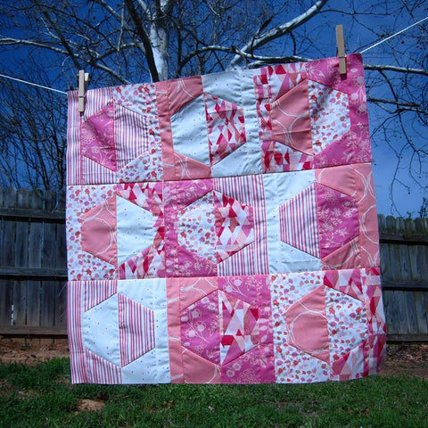Baby quilt pink and white hexagons