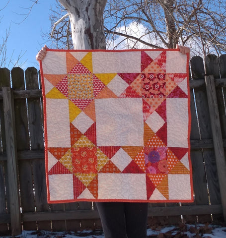 Baby quilt star orange yellow red pink