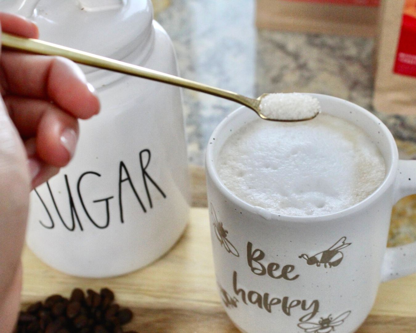 Adding sugar to a cup of coffee