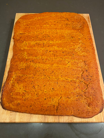 Cooked fermented red lentil flatbread
