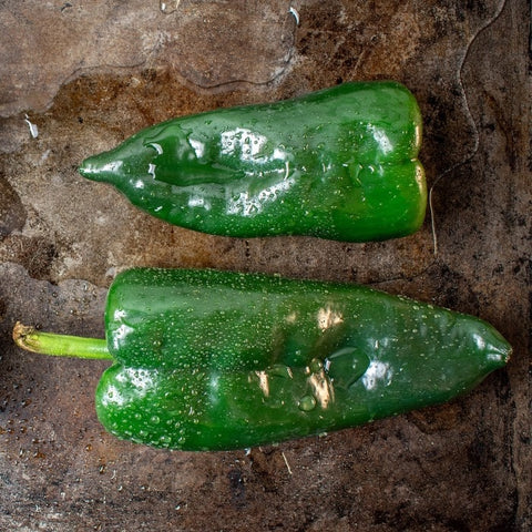 Almanac Planting Poblano Hot Pepper (Capsicum annuum). Image of two harvested peppers side by side.