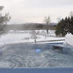 View from hot tub overlooking a snowy field