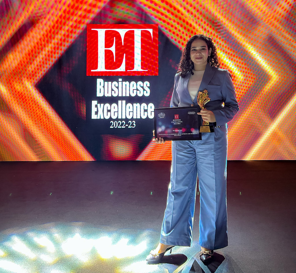Tanisha-Mahajan-proudly-standing-on-stage-at-the-ET-Awards-for-Corporate-Excellence-2023