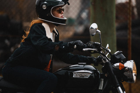 girl sitting on motorcycle