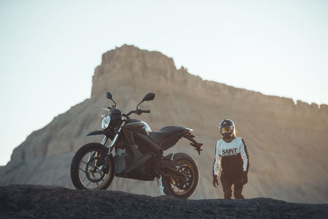 rider standing in desert