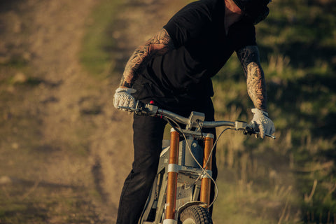 rider with arm tattoos